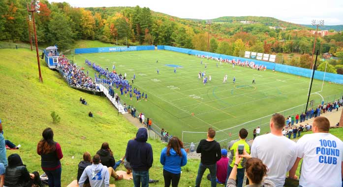 students watching a soccer game