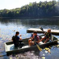 students in small boat