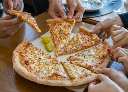 friends sharing pizza