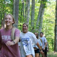 students walking in forest