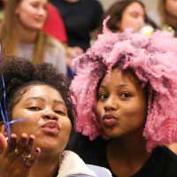 students blowing kiss at camera