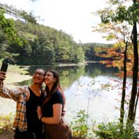 couple takes selfie by lake