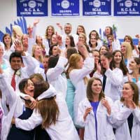 students in white lab coats